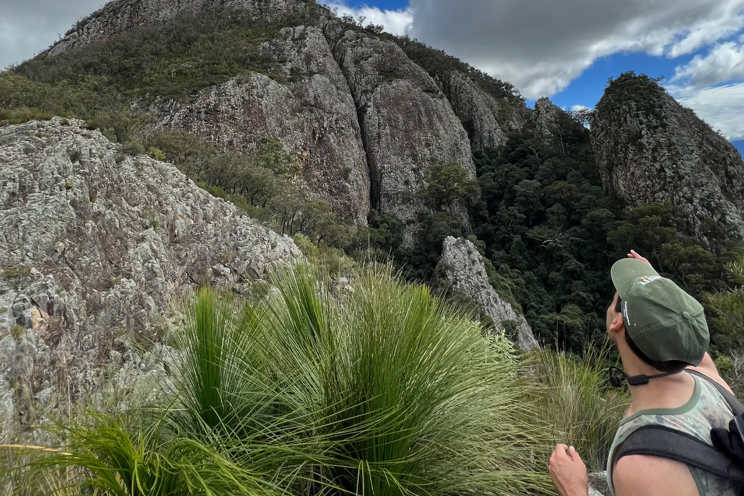 A hiker looking up the mt Greville summit